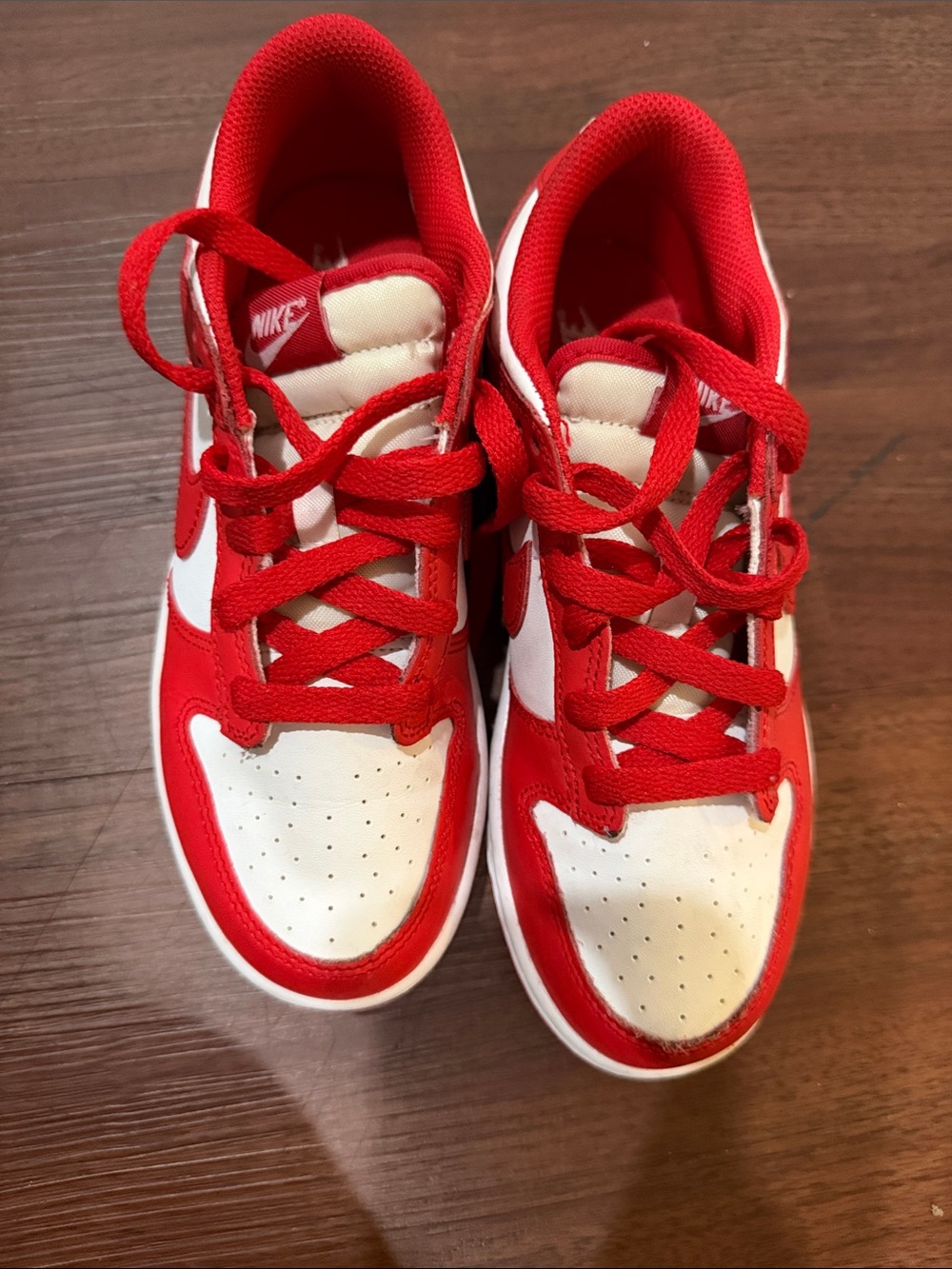 Nike Kids Red and White Low-Top Sneakers with Bold Swoosh